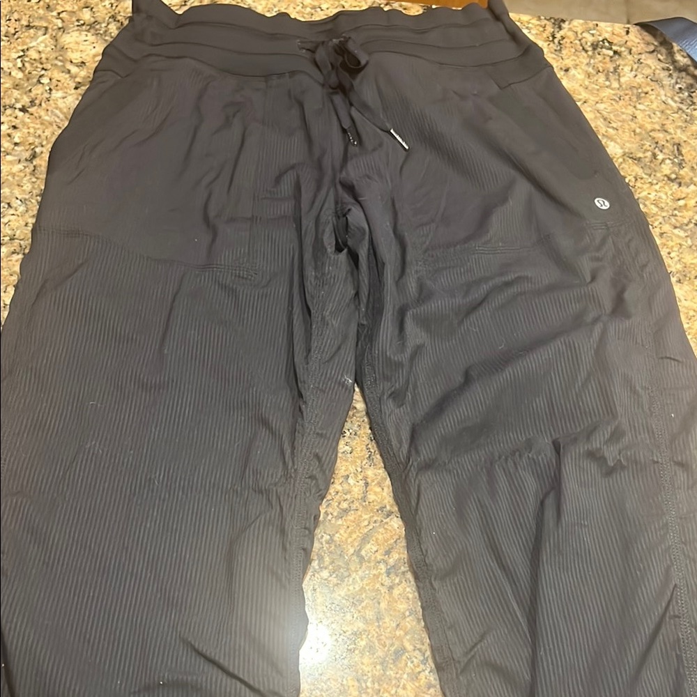 Women’s black lululemon pants, drawstring bottom - size 10 reg